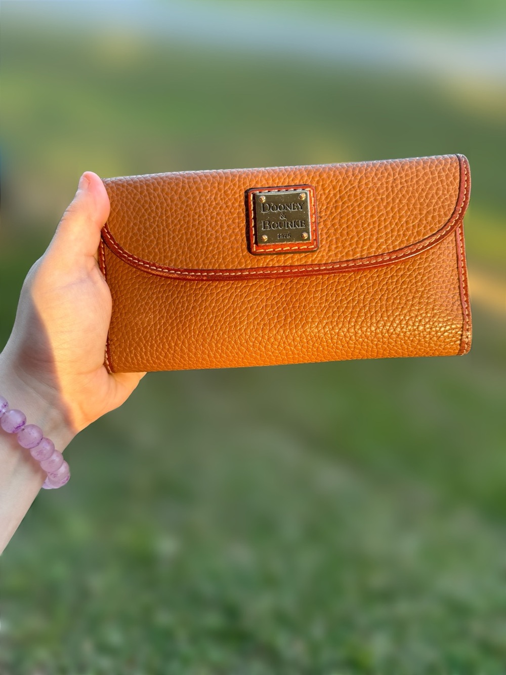 Dooney & Bourke Pebble Leather Continental Wallet in Cognac Brown